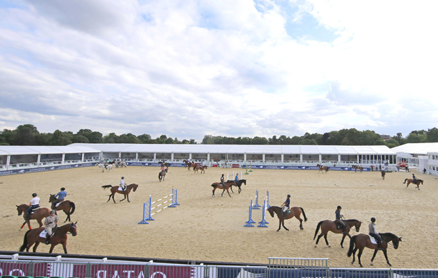 Riders and horses warming up